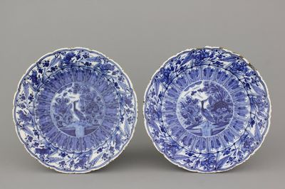 A pair of Dutch Delft blue and white plates with paradise birds, 18th C.