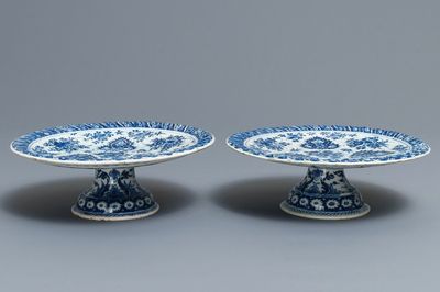 A pair of Dutch Delft blue and white tazza's with floral and ornamental design, 17/18th C.