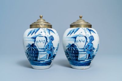 A pair of Dutch Delft blue and white tobacco jars with indians, 18th C.