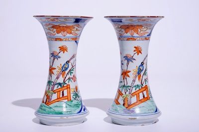 A pair of Dutch Delft polychrome petit feu Kakiemon-style vases, 18th C.
