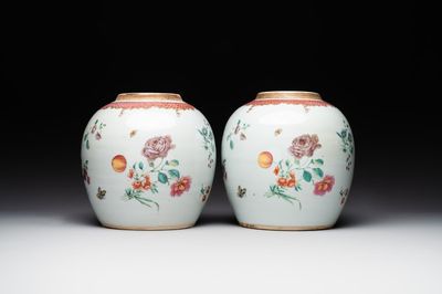 A pair of fine Chinese famille rose 'botanical Merian-style' jars with wooden covers, Qianlong
