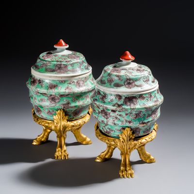 *A pair of fine Chinese famille verte ormolu-mounted barrel-shaped jars and covers, Kangxi