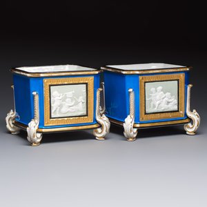 A pair of French gilt blue-ground 'Cherub' jardinières with biscuit-relief plaques, 19/20th C. — photo 1