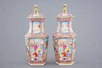 A pair of hexagonal Chinese famille rose mandarin vases and covers, Qianlong, 18th C.