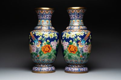 A pair of large Chinese cloisonné vases with birds among flowering branches, 20th C.
