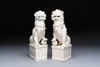 A pair of large Chinese Dehua blanc de Chine Buddhist lion joss stick holders, 19th C.