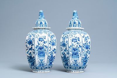 A pair of large Dutch Delft blue and white vases and covers, 18th C.