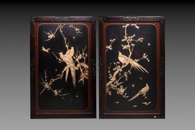 A pair of large Japanese bone-inlaid lacquered wooden panels with birds among flowering branches, 19/20th C.