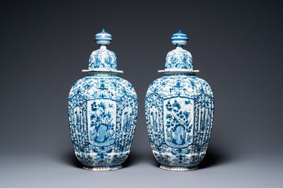 A pair of large ribbed Dutch Delft blue and white covered vases, 1st quarter 18th C.