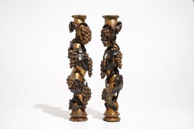 A pair of pillars with grapes, carved wood with gilding and polychromy, 18th C.
