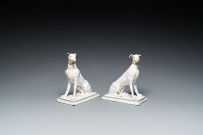 A pair of polychrome Brussels faience greyhounds, 18th C.