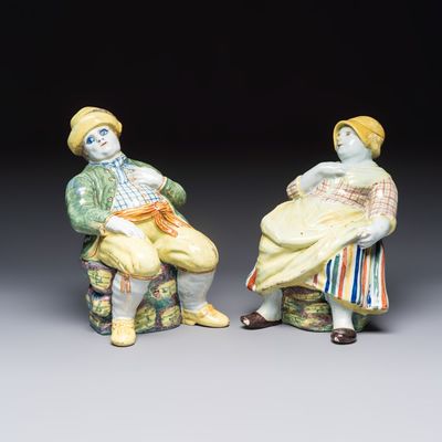 A pair of polychrome Dutch Delft 'Bobbejak' ewers and covers, 18th C.
