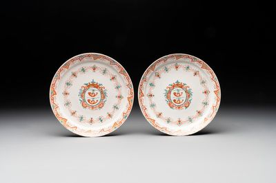A pair of polychrome Dutch Delft doré armorial plates, dated 1728