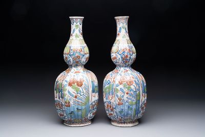 A pair of polychrome Dutch Delft double gourd vases, 19th C.