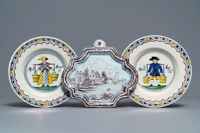 A pair of polychrome Dutch Delft 'Milkmaid' plates and a blue and manganese plaque, 18th C.
