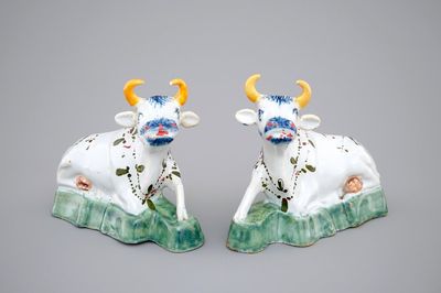 A pair of polychrome Dutch Delft models of cows, 18th C.