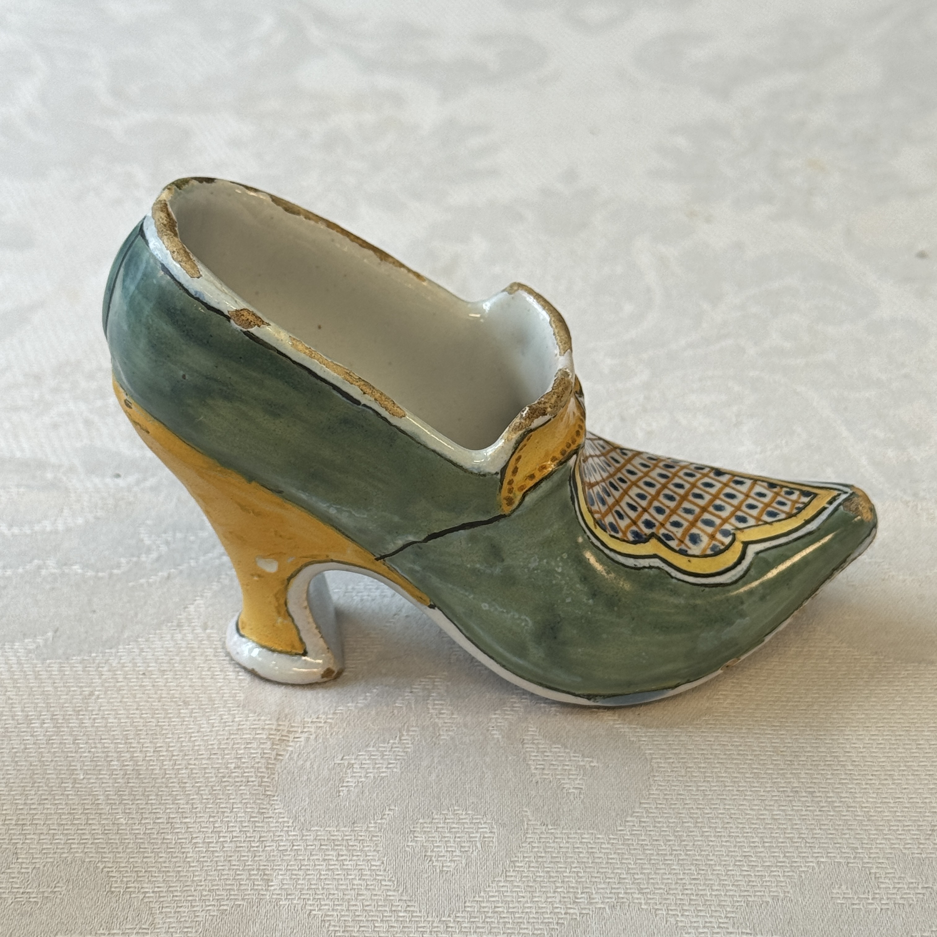 A pair of polychrome Dutch Delft models of shoes — photo 11