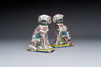 A pair of polychrome Dutch Delft money banks modelled as dogs, 18th C.