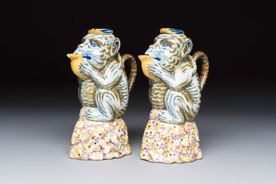 A pair of polychrome Dutch Delft monkey ewers and covers, 18th C.