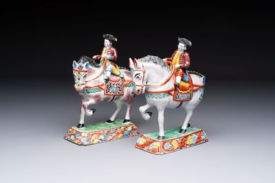 A pair of polychrome Dutch Delft petit feu models of horses with riders, 18th C.