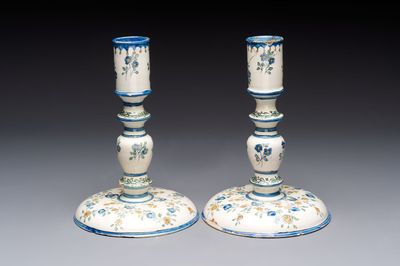 A pair of polychrome French faience candlesticks, 18th C.