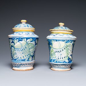 A pair of polychrome Italian maiolica covered albarelli with 'a trofei' design, Casteldurante, dated 1576 — photo 1