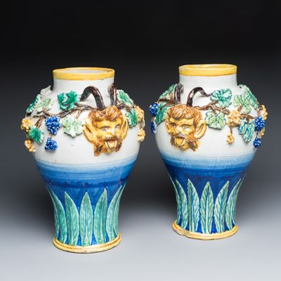 A pair of polychrome Italian maiolica vases with applied satyr masks and grapevine decoration, 19th C.