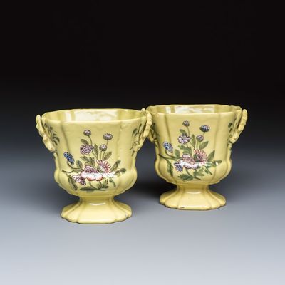 A pair of polychrome yellow-ground Dutch Delft jardinières with floral design, 18th C.