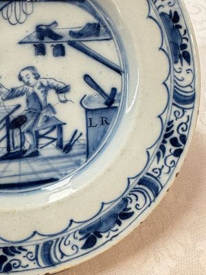 A pair of rare blue and white Dutch Delft 'Shoemaker' plates, 18th C. — photo 17