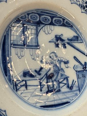 A pair of rare blue and white Dutch Delft 'Shoemaker' plates, 18th C. — photo 18