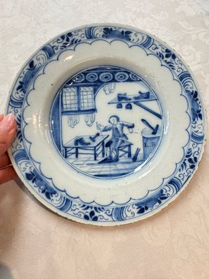 A pair of rare blue and white Dutch Delft 'Shoemaker' plates, 18th C. — photo 2