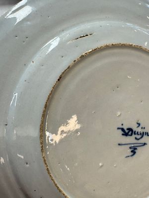 A pair of rare blue and white Dutch Delft 'Shoemaker' plates, 18th C. — photo 21