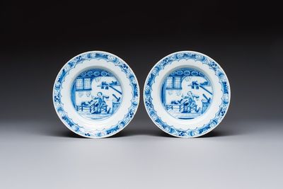 A pair of rare blue and white Dutch Delft 'Shoemaker' plates, 18th C.