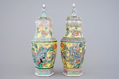 A pair of rare hexagonal Chinese famille jaune porcelain vases with figural covers, 19th C.