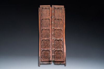 A pair of reticulated wooden doors with geometrical patterns, Northern Africa, 19th C.