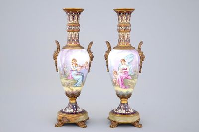 A pair of Sèvres porcelain vases with bronze and champleve enamel mounts, 19th C.