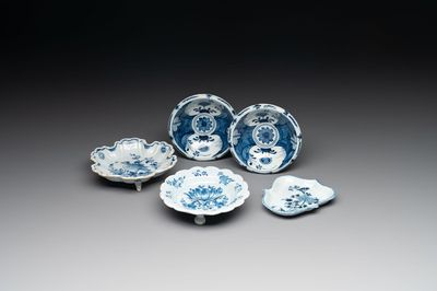 A pair of small blue and white Dutch Delft bowls, two tripod salts and a condiment dish, 17/18th C.