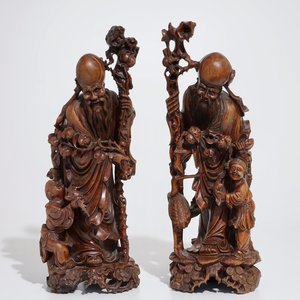 A pair of tall Chinese carved wood figures of immortals, 19/20th C. — photo 1