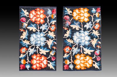 A pair of Tibetan woollen rugs with floral design, 19th C.