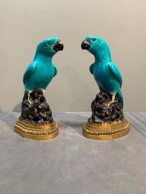 A pair of turquoise- and aubergine-glazed parrots with gilt bronze mounts, Kangxi — photo 1