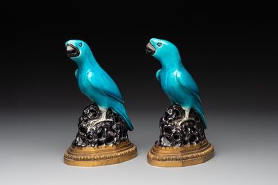 A pair of turquoise- and aubergine-glazed parrots with gilt bronze mounts, Kangxi