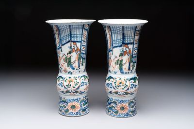 A pair of unusual polychrome Dutch Delft Kangxi-style chinoiserie beaker vases, early 18th C.