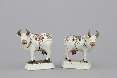 A pair of white Delft cold-painted cows, Dutch, 18th C.