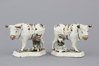 A pair of white Delft cold-painted milking groups, 18th C.