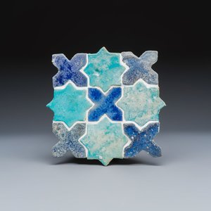 A panel of nine Kashan turquoise- and blue-glazed star and cross tiles — photo 1