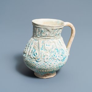A Persian turquoise-glazed moulded calligraphic ewer, Kashan, 13/14th C. — 照片 1
