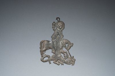 A pewter pilgrim's badge depicting Saint George fighting the dragon, The Netherlands, 14th C.