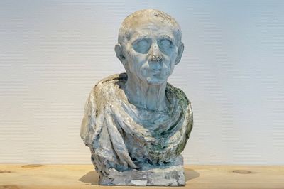 A plaster cast of a bust of a Roman emperor, 19/20th C., Bruges