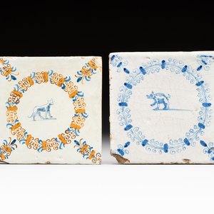 A polychrome and a blue and white Dutch Delft tile with an animal in an aigrette border, Haarlem, early 17th C. — photo 1