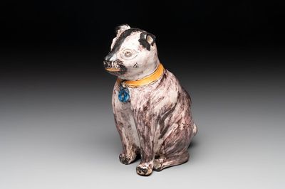 A polychrome Brussels faience model of a dog, 18th C.